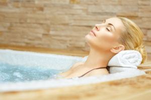 woman relaxing in pigeon forge jacuzzi suite