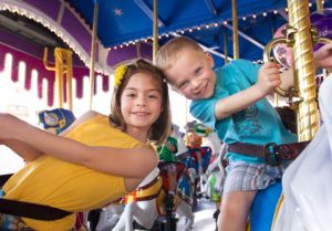 happy kids on carousel